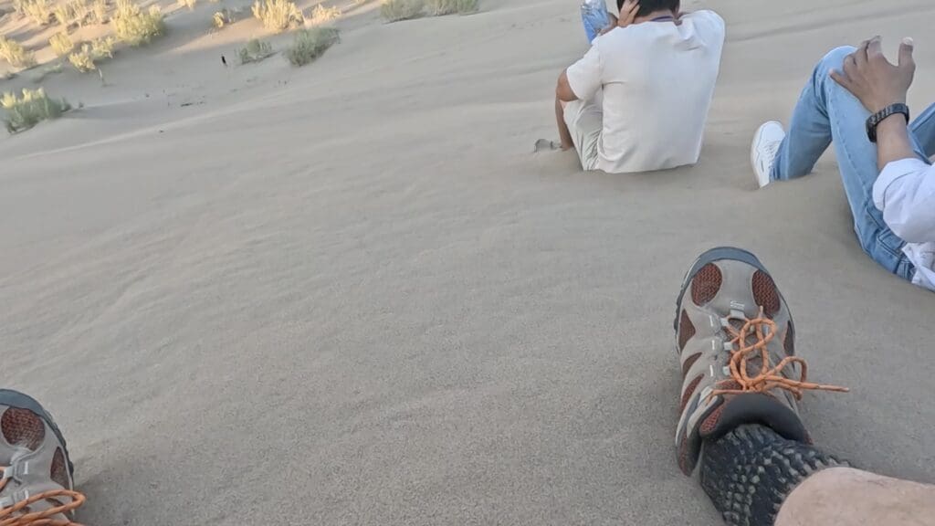 Scooting Down the Dune to Make it Sing