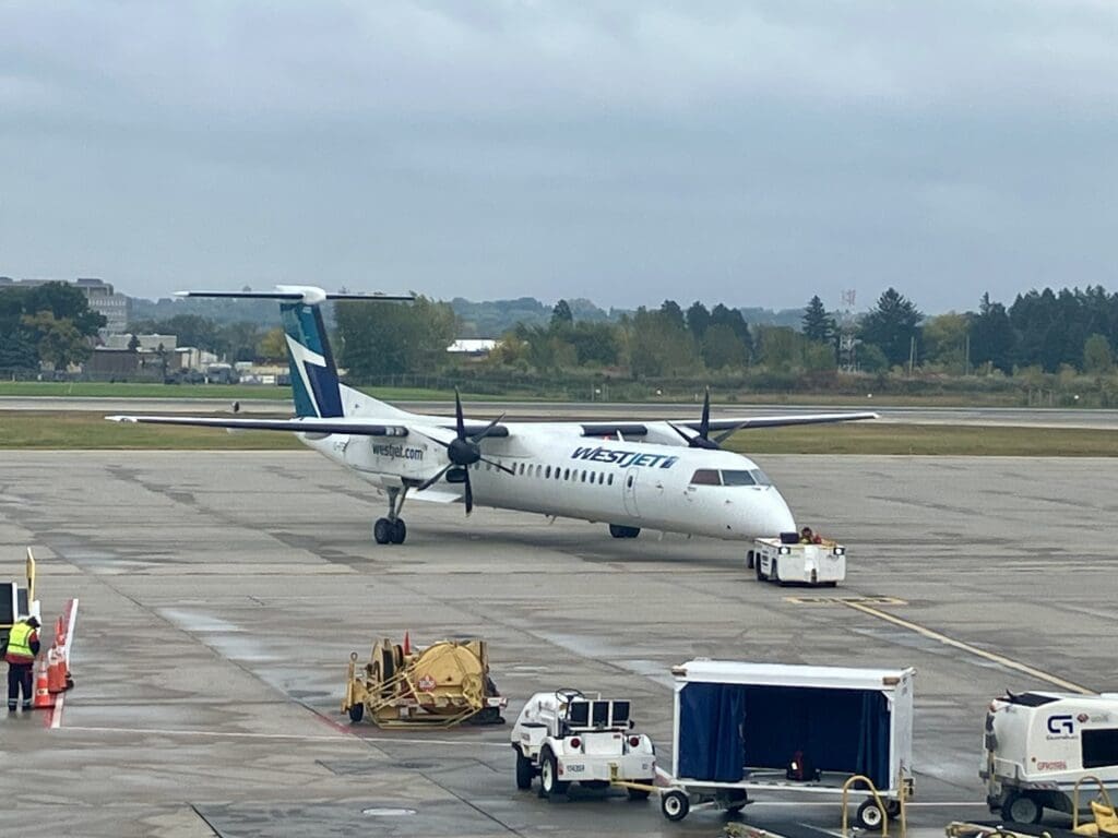 WestJet Encore's Dash 8 Q400 - Arriving Via Tow